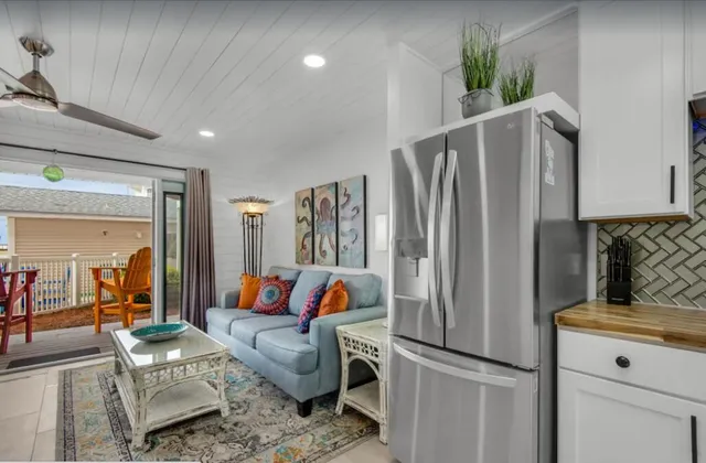 a kitchen with stainless steel appliances granite countertop a refrigerator and a stove