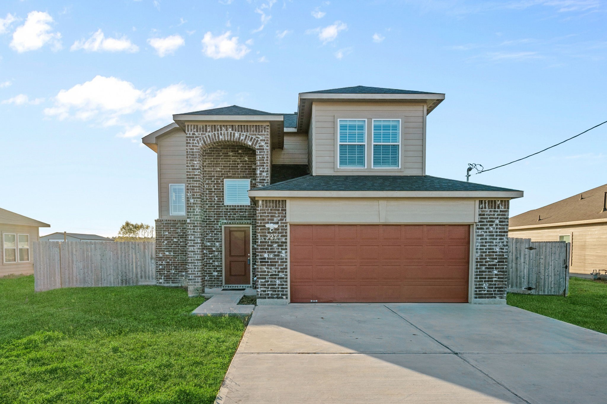 727 Road 5105 Cleveland, TX 77327 - Photo 2 of 22 a front view of a house with garden