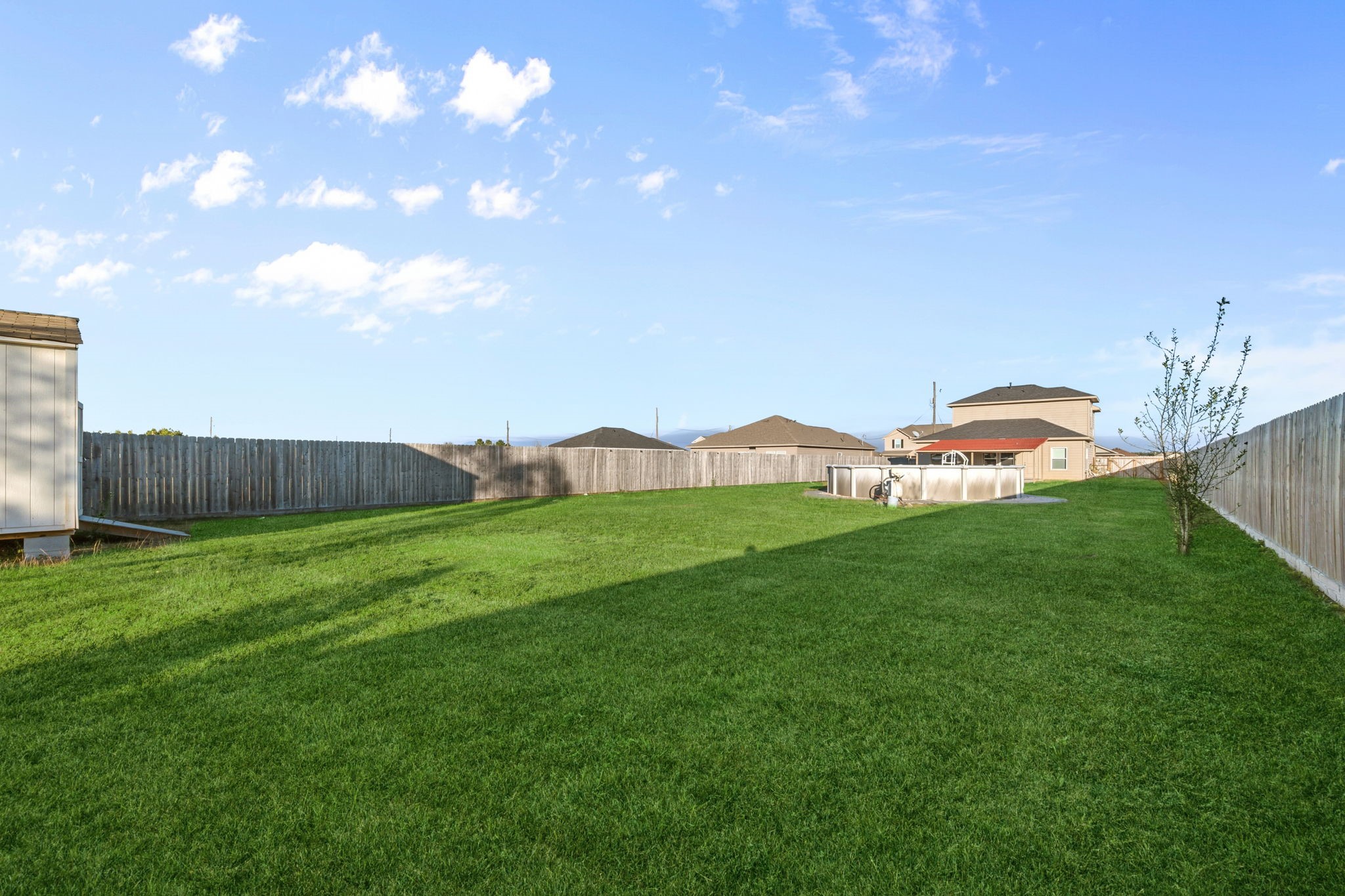 727 Road 5105 Cleveland, TX 77327 - Photo 21 of 22 a view of a back yard