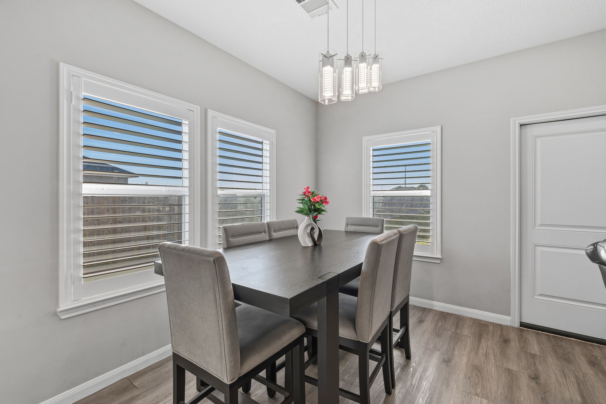 727 Road 5105 Cleveland, TX 77327 - Photo 9 of 22 a view of a dining room with furniture window and wooden floor