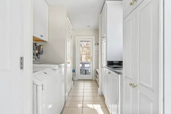 a kitchen with white cabinets