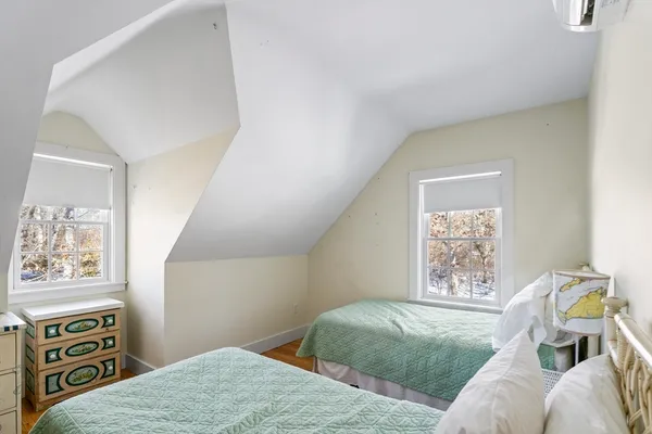 a bedroom with furniture and a window