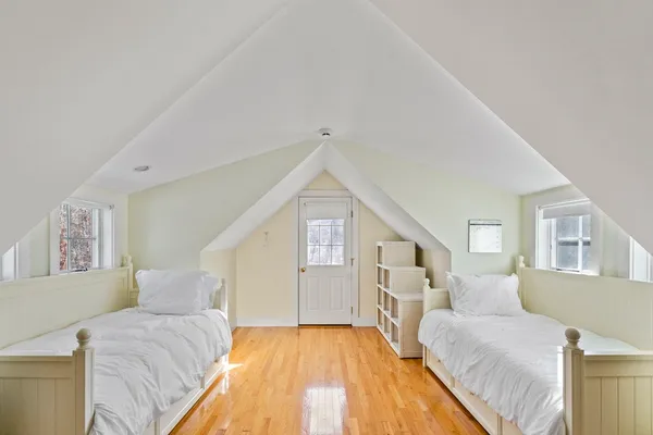 a spacious bedroom with a bed and a couch