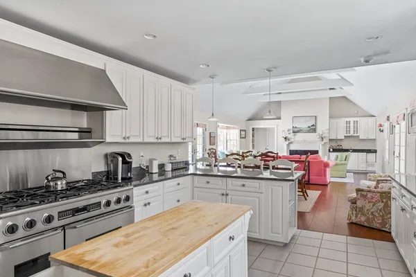 a kitchen with a stove and a refrigerator