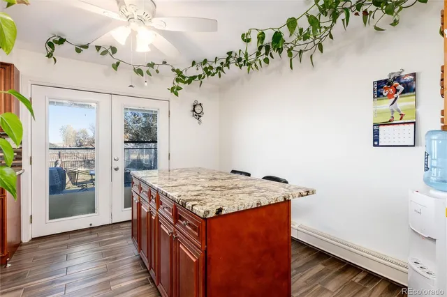 a kitchen that has a table and chairs in it