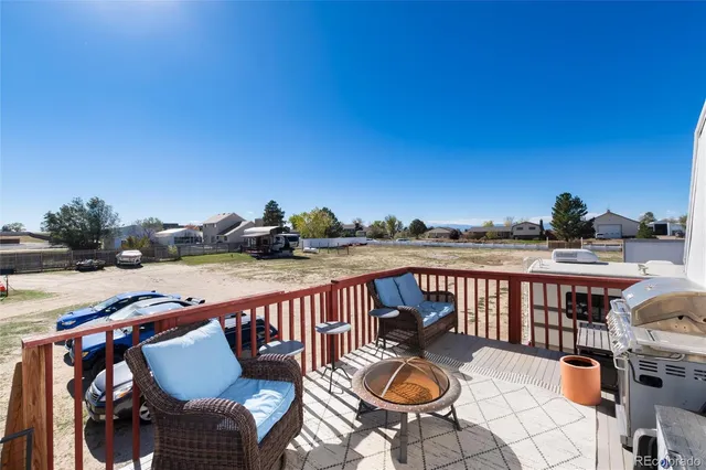 a view of a patio with furniture