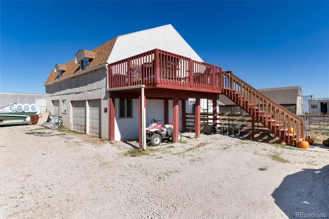 a view of a house with wooden deck