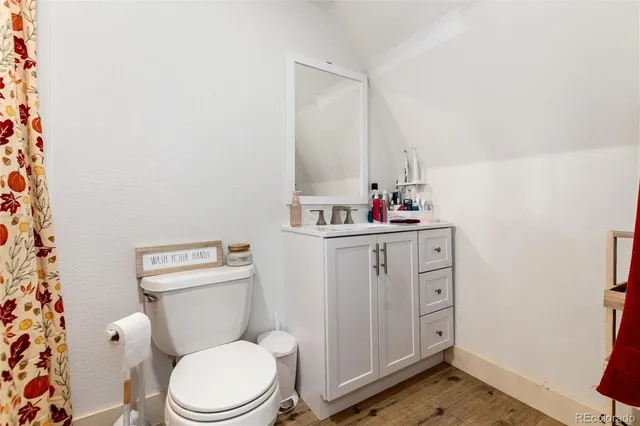 a white toilet sitting next to a bathroom sink