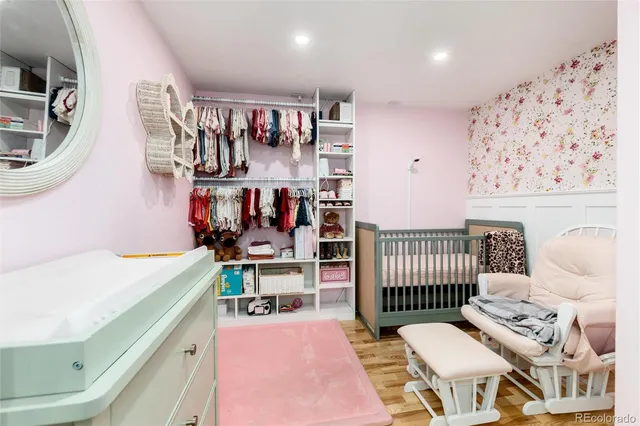 a bedroom with a bed and a desk