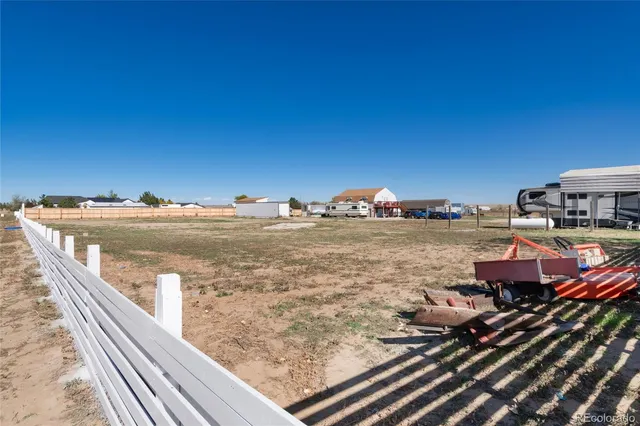an aerial view of houses with outdoor space