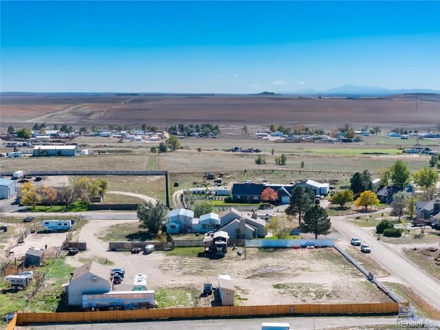 an aerial view of a house with a ocean view