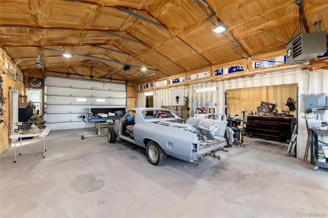 a view of parking garage with cars