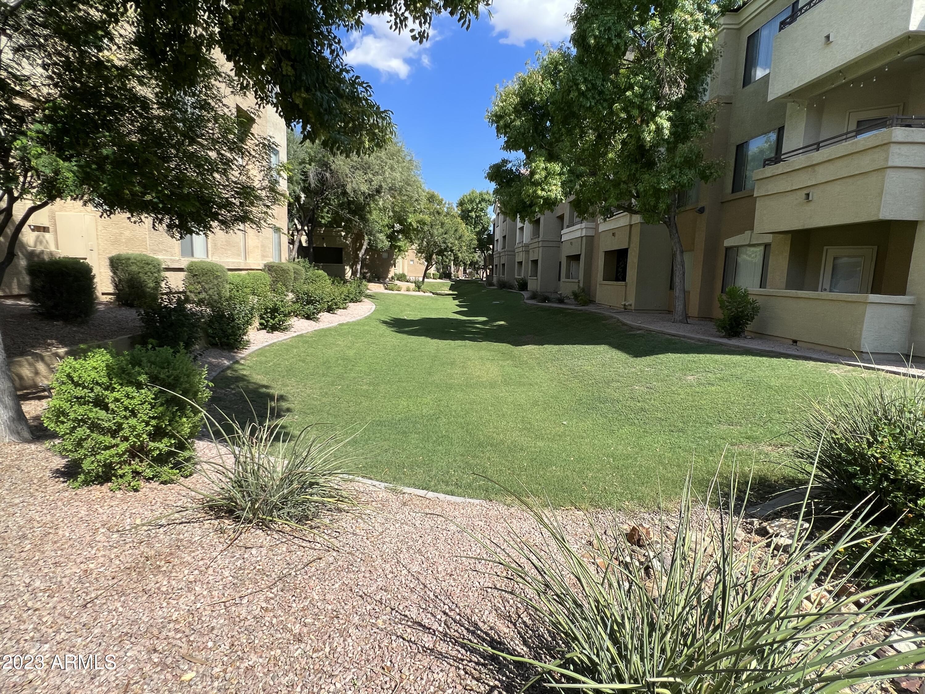 18416 North Cave Creek Road, Unit 1059 Phoenix, AZ 85032 - Photo 44 of 45 Greenbelt right next to Building