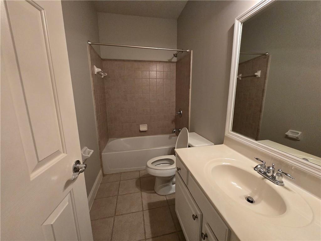 624 Maple Grove Way Marietta, GA 30066 - Photo 18 of 27 a bathroom with a sink a toilet and shower