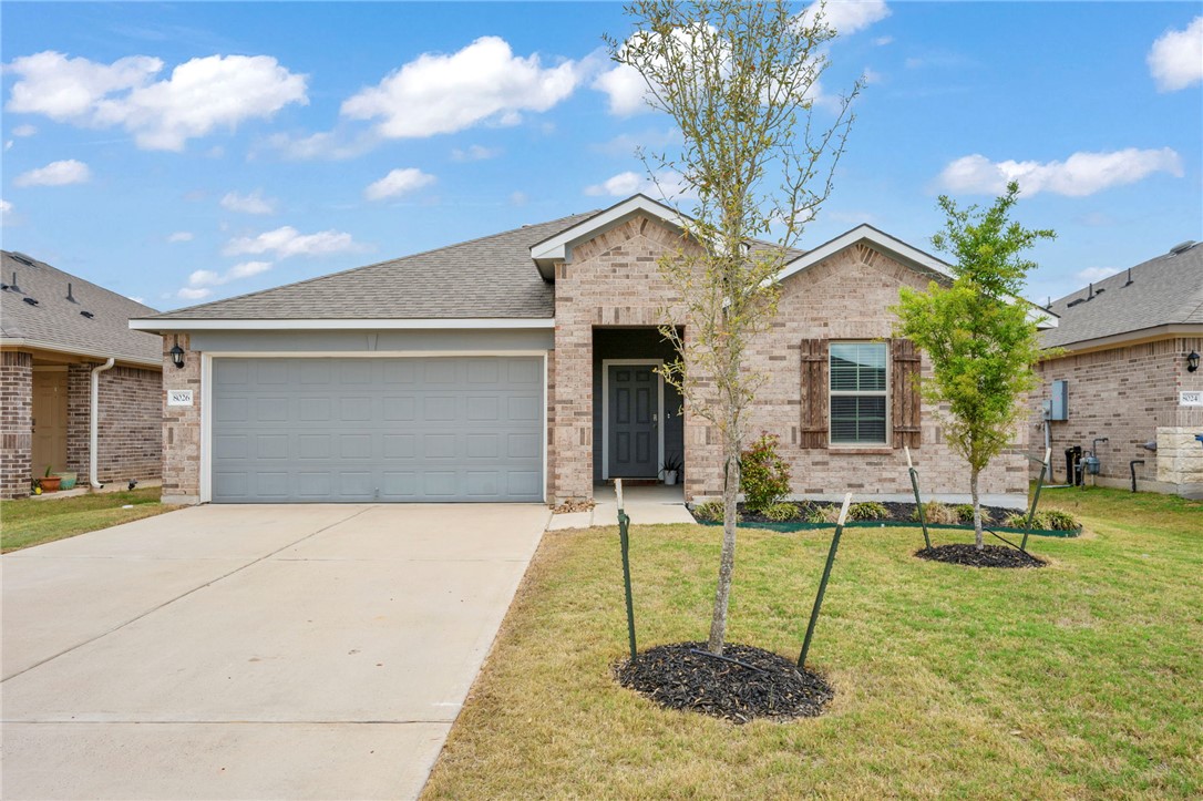 8026 Front Nine Lane Navasota, TX 77868 - Photo 1 of 22 a backyard of a house with table and chairs