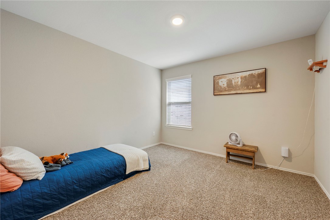 8026 Front Nine Lane Navasota, TX 77868 - Photo 11 of 22 a living room with furniture and a window