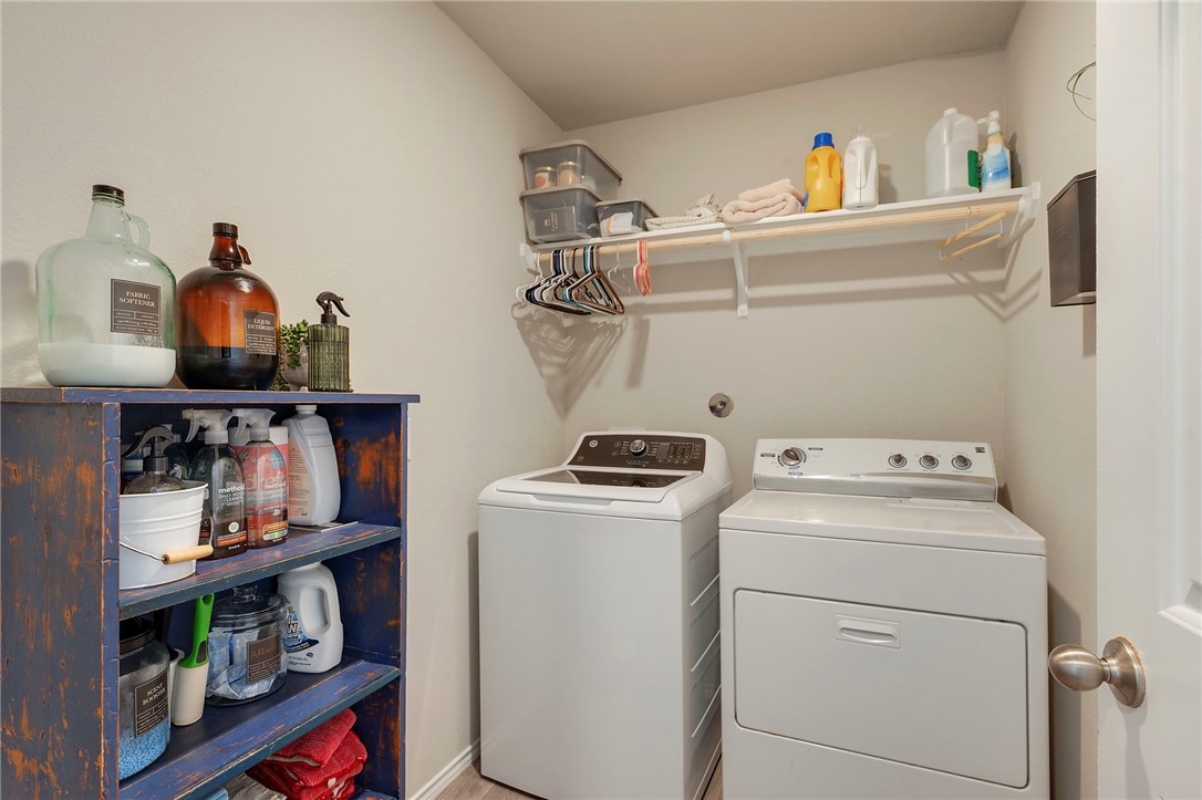 8026 Front Nine Lane Navasota, TX 77868 - Photo 15 of 22 a utility room with dryer and washer
