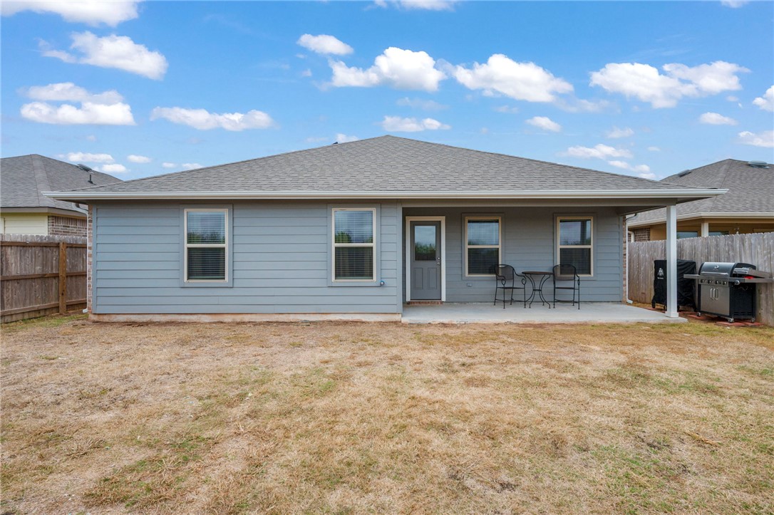 8026 Front Nine Lane Navasota, TX 77868 - Photo 16 of 22 a front view of a house with yard