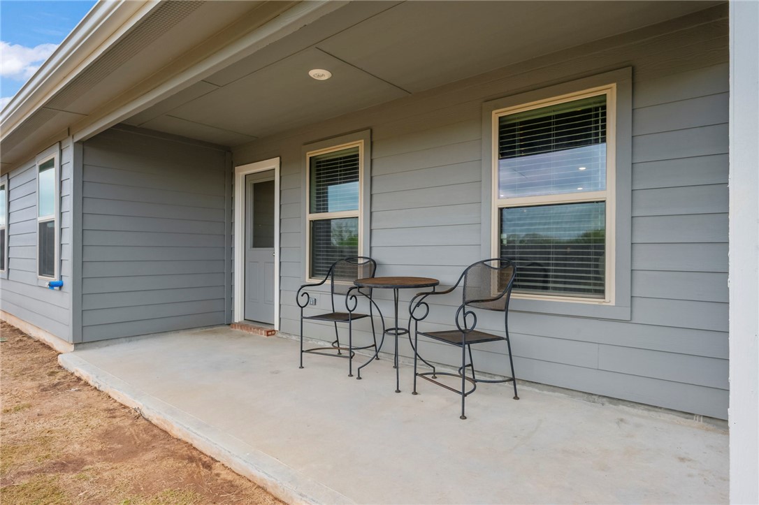 8026 Front Nine Lane Navasota, TX 77868 - Photo 18 of 22 a view of an outdoor space with porch