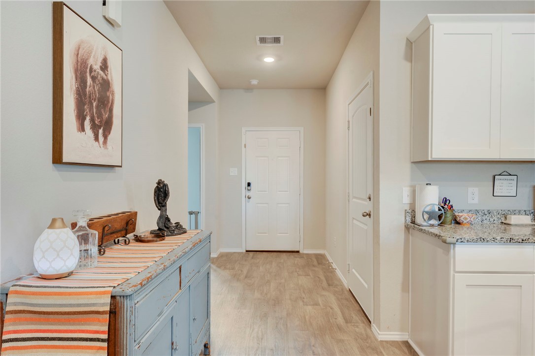 8026 Front Nine Lane Navasota, TX 77868 - Photo 2 of 22 a kitchen that has a sink and a stove in it