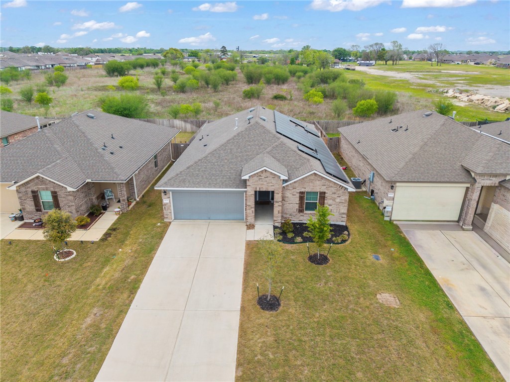 8026 Front Nine Lane Navasota, TX 77868 - Photo 22 of 22 an aerial view of a house with a yard