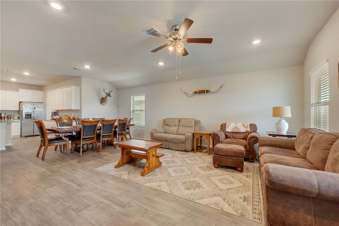 8026 Front Nine Lane Navasota, TX 77868 - Photo 7 of 22 a living room with furniture and kitchen view