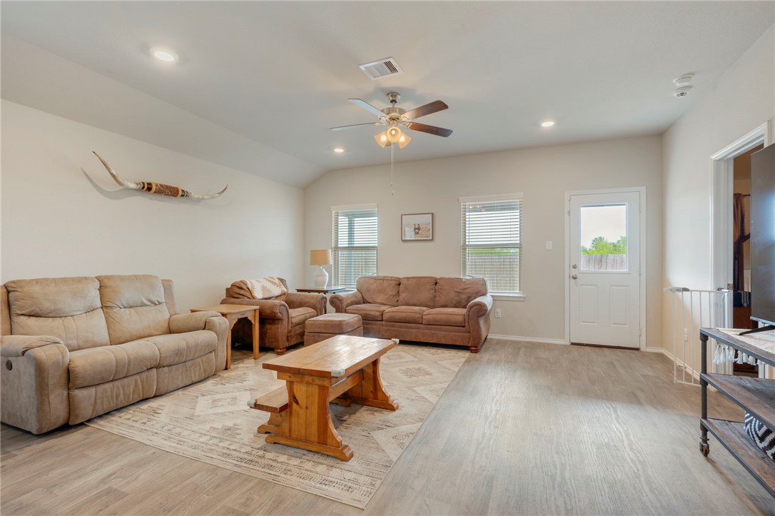 8026 Front Nine Lane Navasota, TX 77868 - Photo 8 of 22 a living room with furniture and a flat screen tv