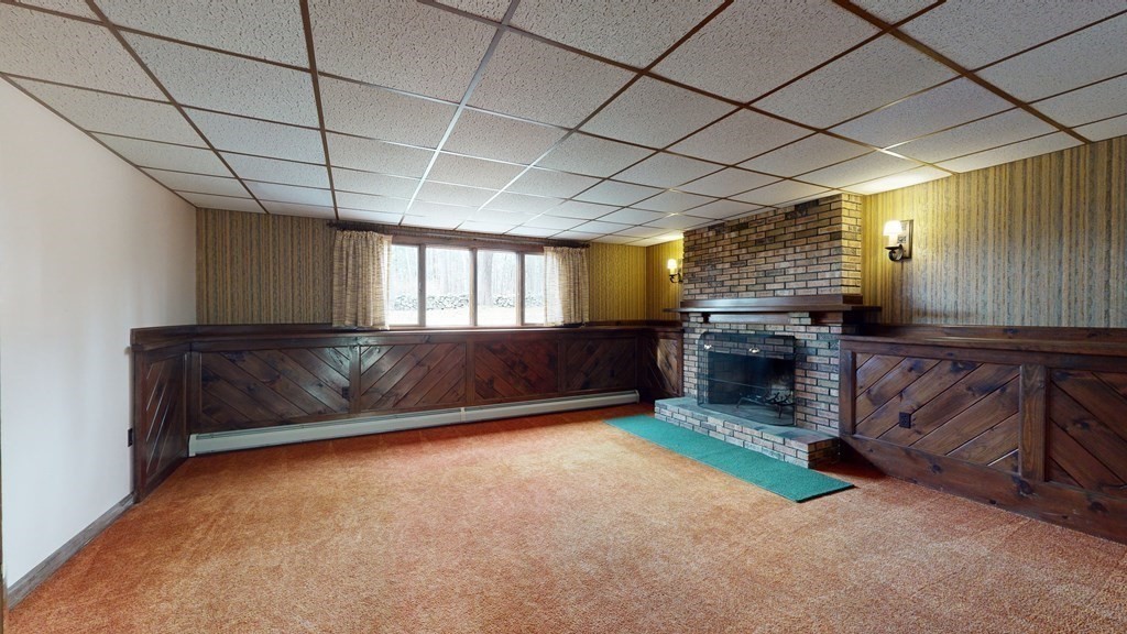91 Dodge Hill Road Sutton, MA 01590 - Photo 27 of 42 a view of an empty room with a fireplace