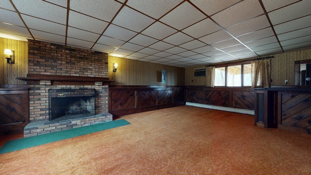 91 Dodge Hill Road Sutton, MA 01590 - Photo 29 of 42 a view of an empty room with a fireplace and a window