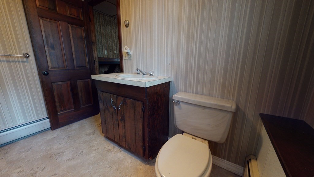 91 Dodge Hill Road Sutton, MA 01590 - Photo 33 of 42 a bathroom with a toilet a sink and mirror
