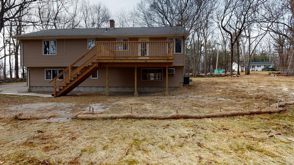 91 Dodge Hill Road Sutton, MA 01590 - Photo 8 of 42 a front view of a house with a yard