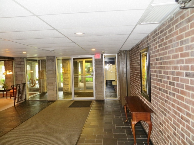 2600 Windsor Mall, Unit 3A Park Ridge, IL 60068 - Photo 2 of 18 a lobby with furniture and floor to ceiling window