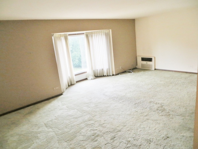 2600 Windsor Mall, Unit 3A Park Ridge, IL 60068 - Photo 6 of 18 a view of an empty room with a window