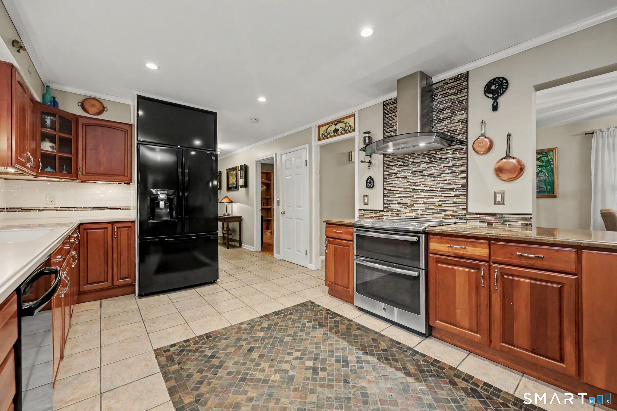 571 Wheeler Road Monroe, CT 06468 - Photo 11 of 40 a kitchen with stainless steel appliances granite countertop a refrigerator and a stove