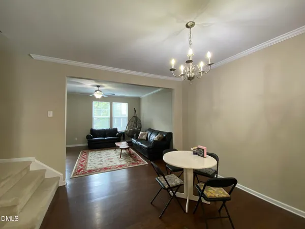 a view of a livingroom with furniture and a table