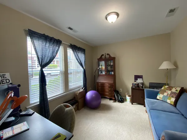 a view of a livingroom with furniture and a window