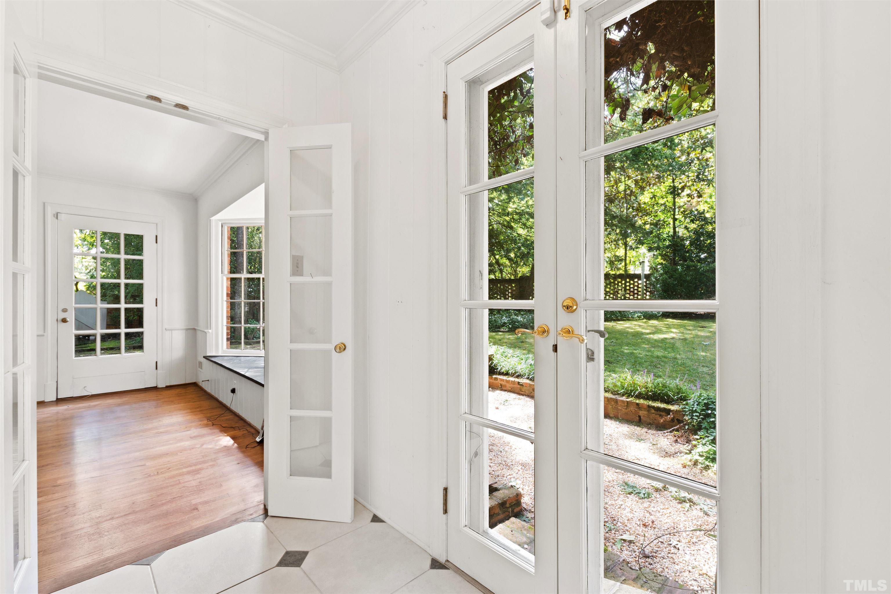 3231 Sussex Road Raleigh, NC 27607 - Photo 17 of 60 wooden floor in an empty room with a window