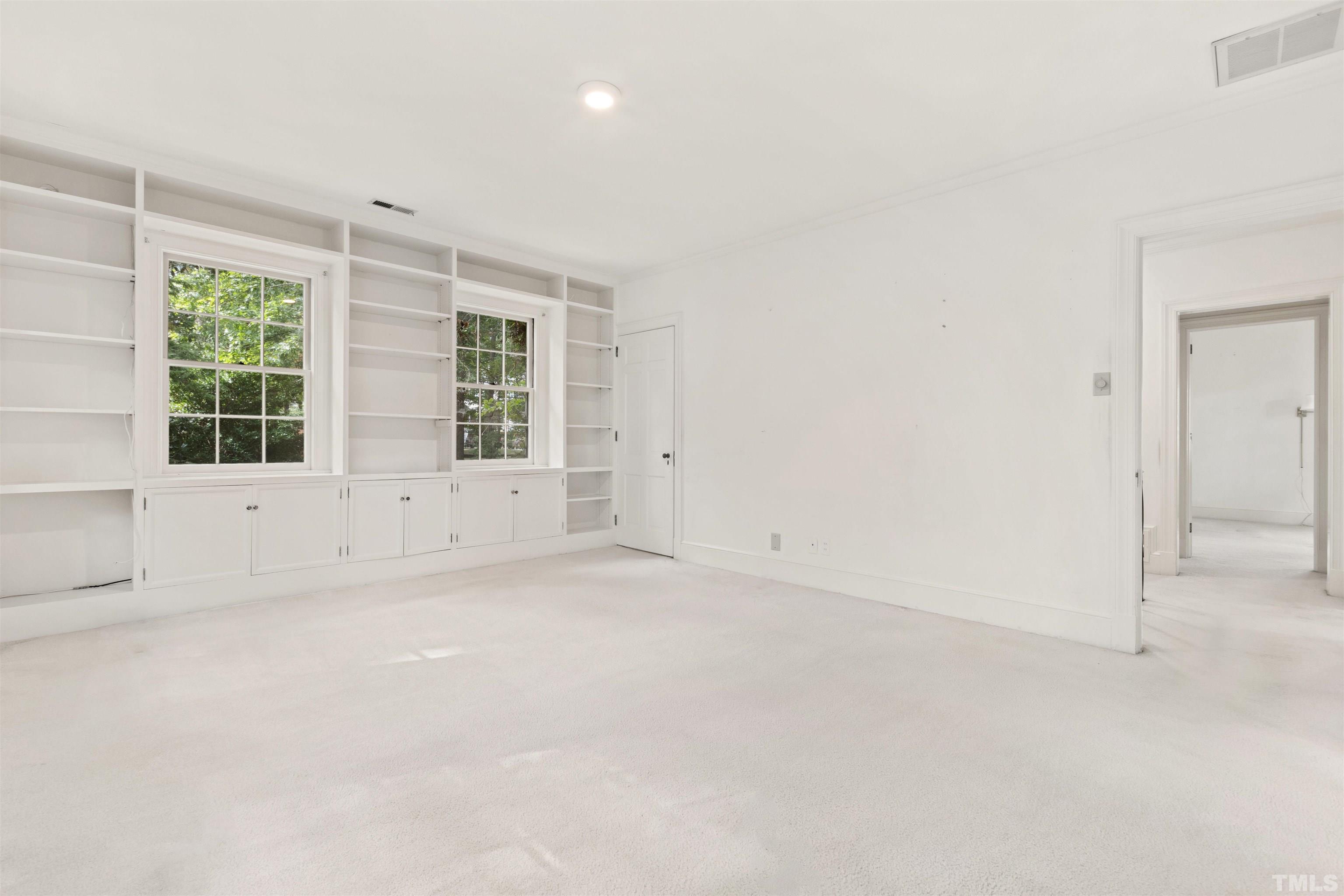 3231 Sussex Road Raleigh, NC 27607 - Photo 21 of 60 an empty room with windows