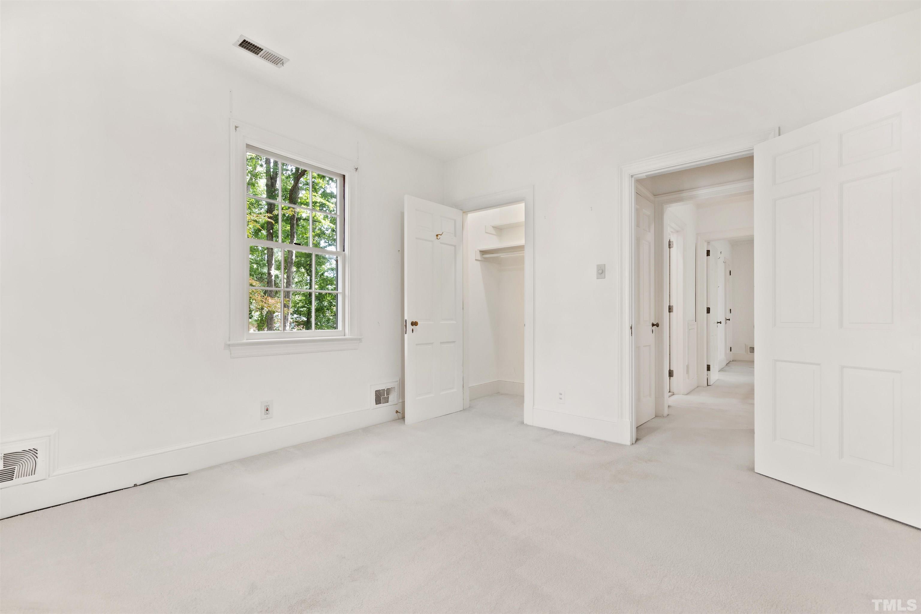 3231 Sussex Road Raleigh, NC 27607 - Photo 27 of 60 an empty room with windows and closet