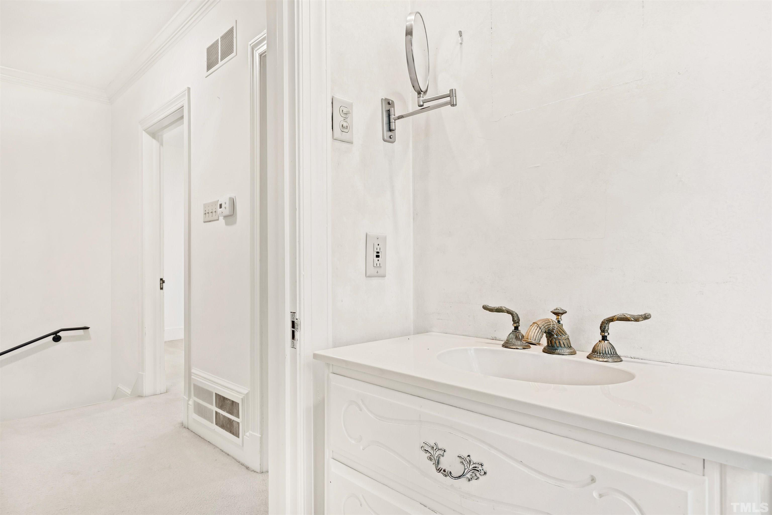 3231 Sussex Road Raleigh, NC 27607 - Photo 28 of 60 a bathroom with a sink and shower