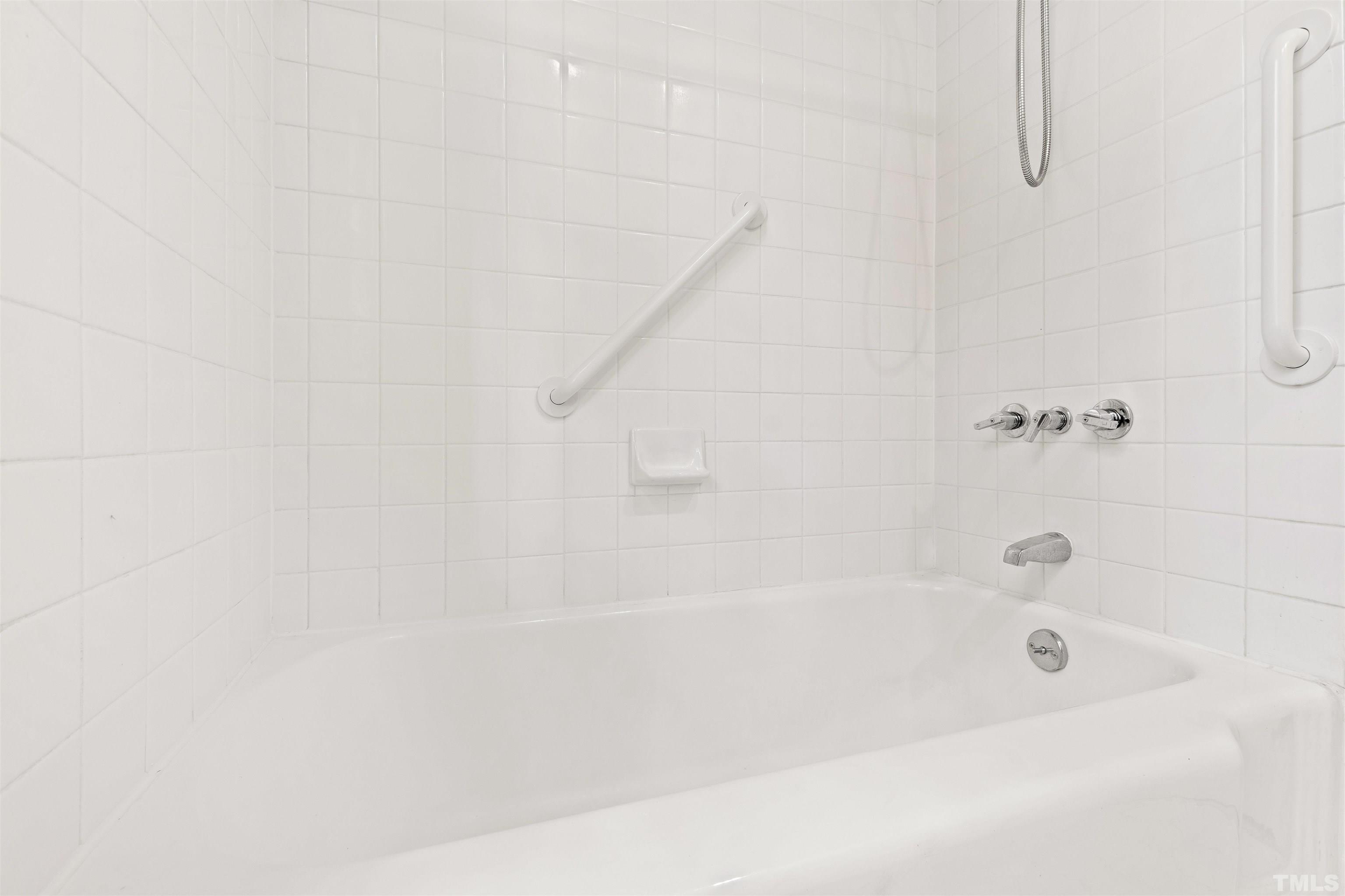 3231 Sussex Road Raleigh, NC 27607 - Photo 29 of 60 a bathroom with a bathtub
