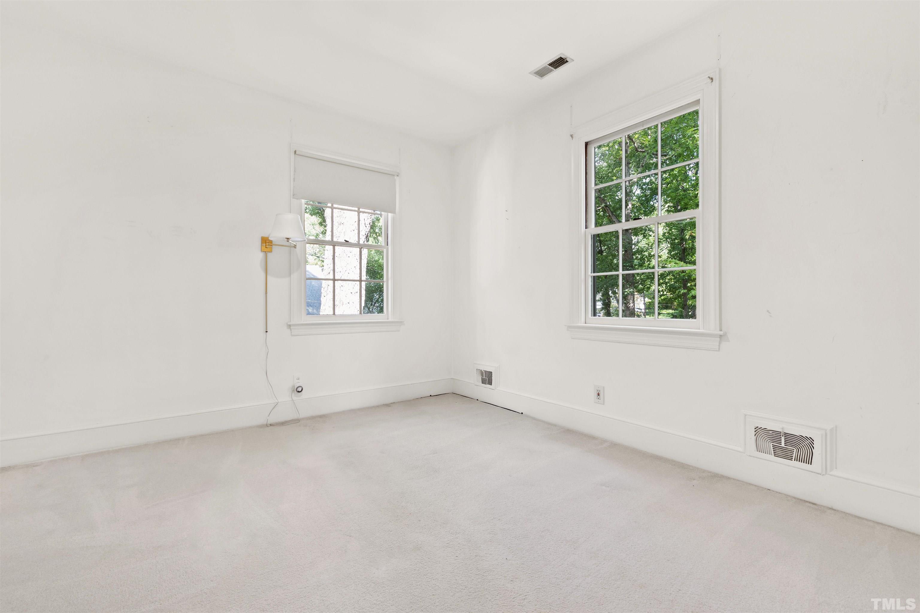 3231 Sussex Road Raleigh, NC 27607 - Photo 30 of 60 an empty room with a window