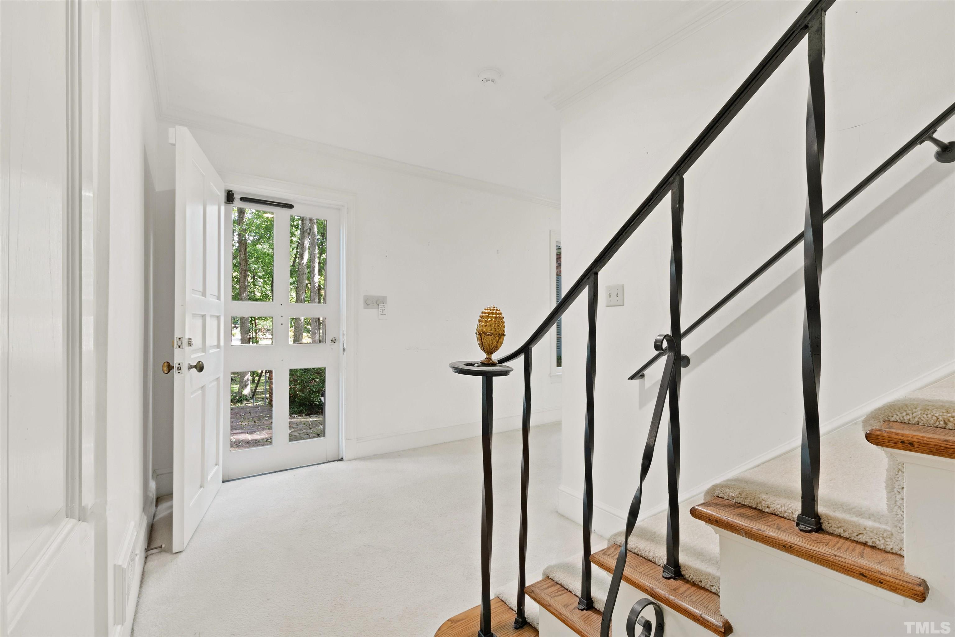 3231 Sussex Road Raleigh, NC 27607 - Photo 3 of 60 a view of an entryway with wooden floor