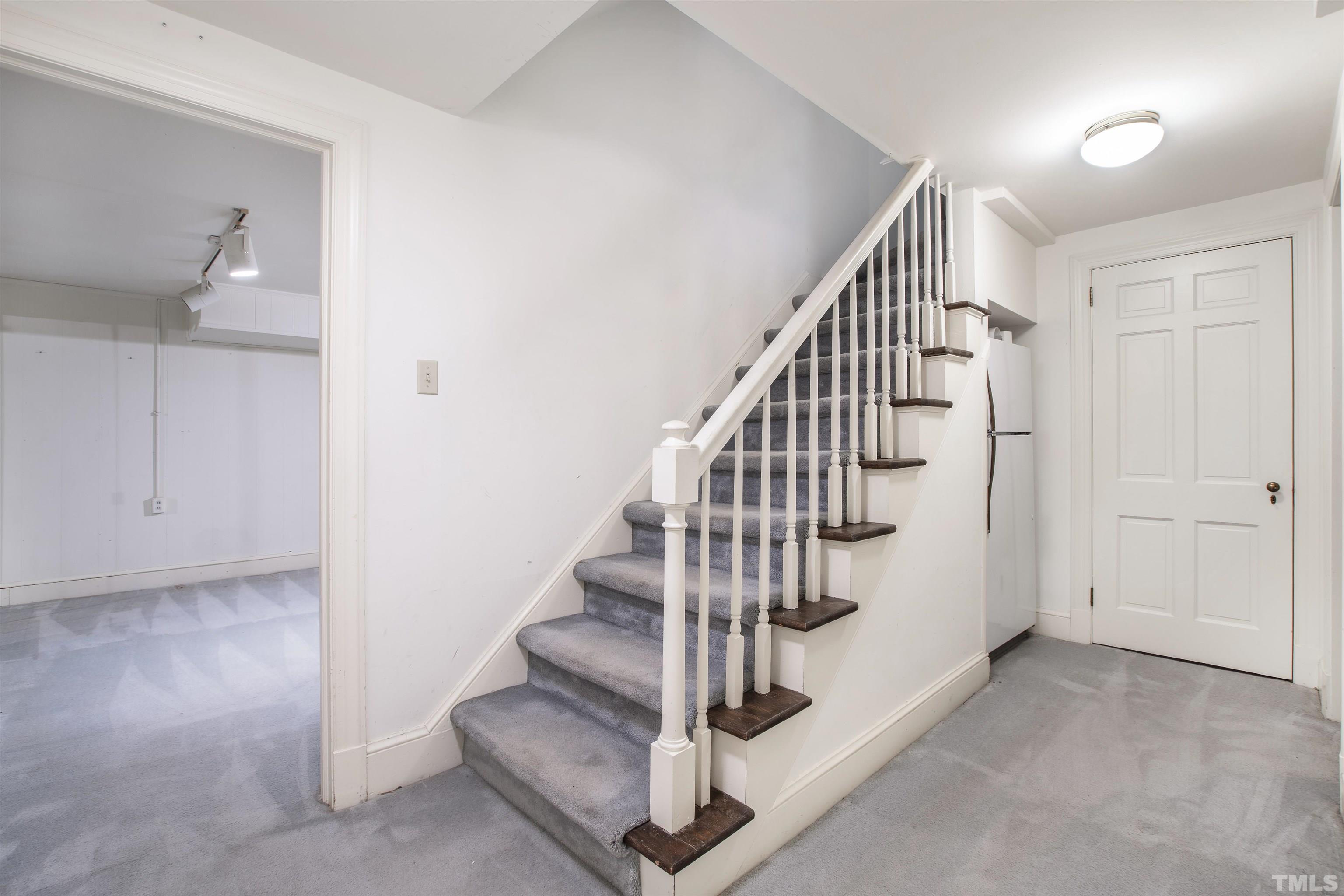3231 Sussex Road Raleigh, NC 27607 - Photo 32 of 60 a view of entryway and hall with wooden floor