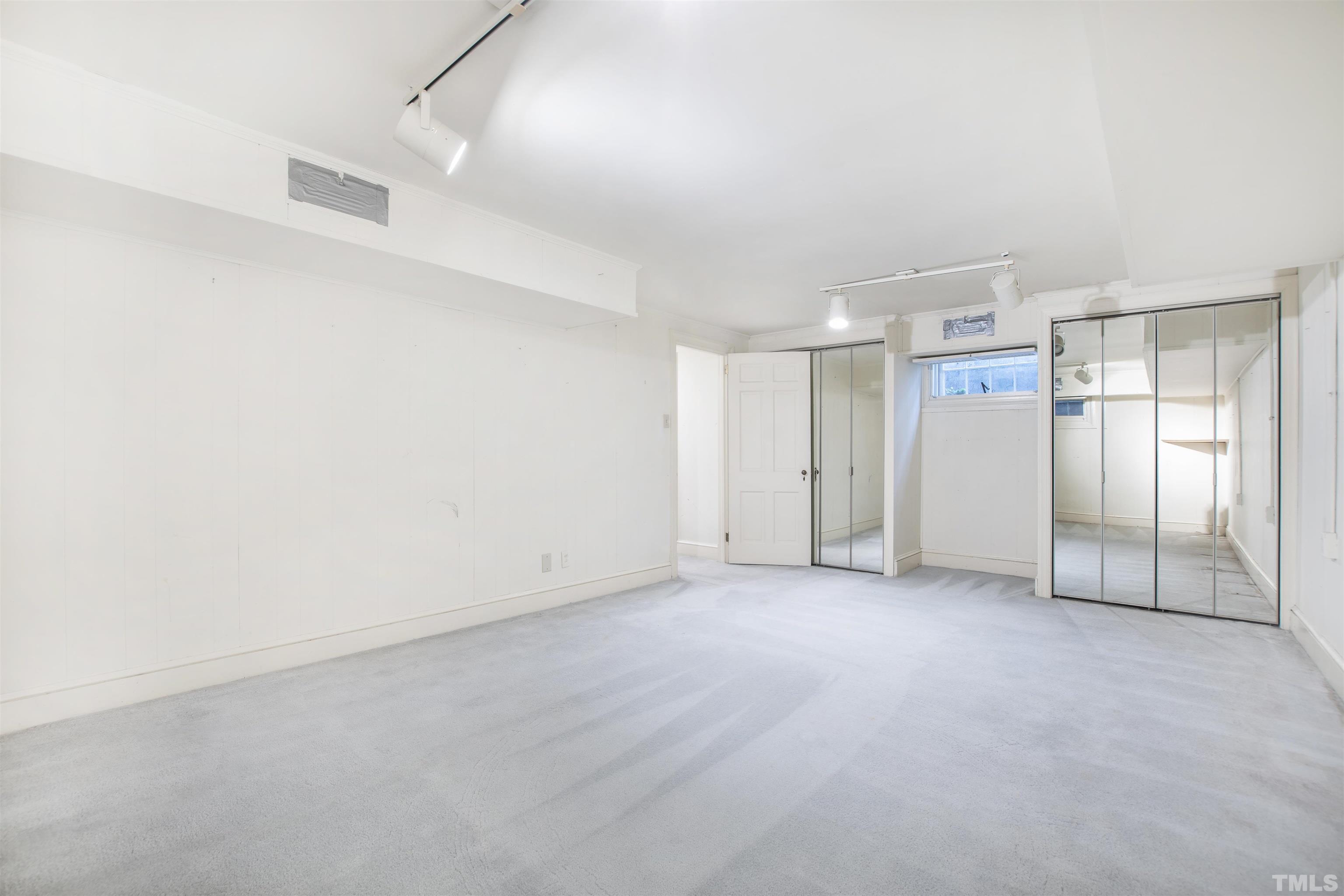 3231 Sussex Road Raleigh, NC 27607 - Photo 33 of 60 an empty room with window