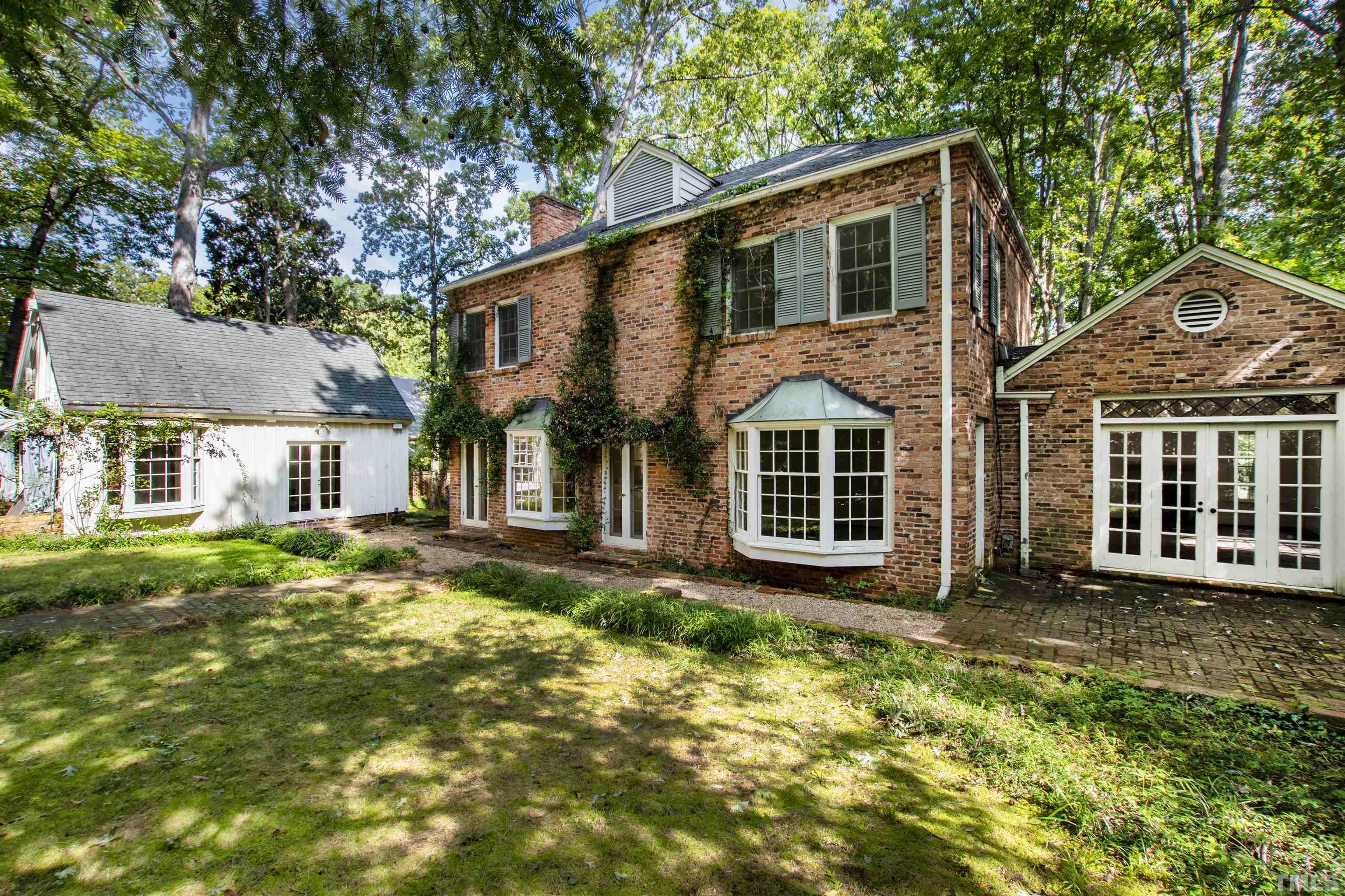 3231 Sussex Road Raleigh, NC 27607 - Photo 37 of 60 a view of a yard in front of a house