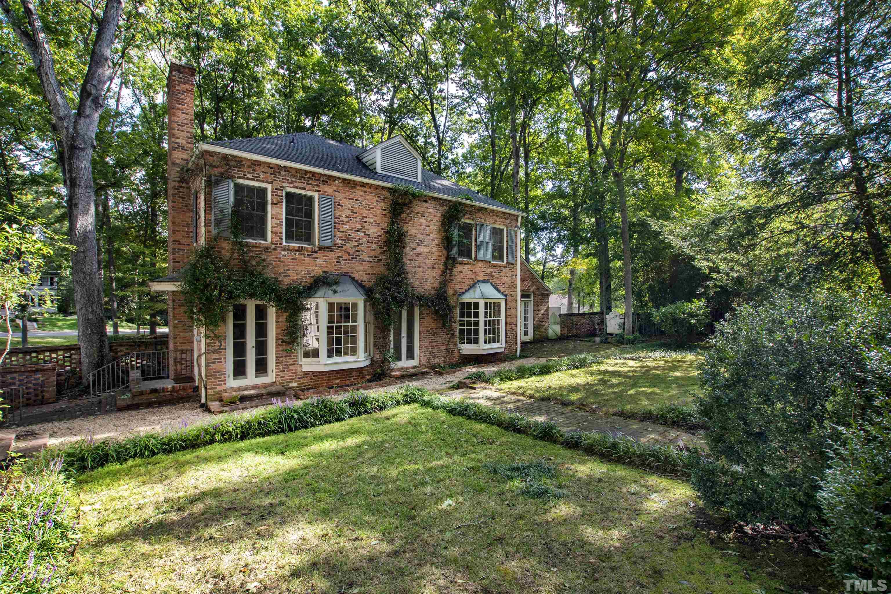 3231 Sussex Road Raleigh, NC 27607 - Photo 38 of 60 a front view of a house with a yard