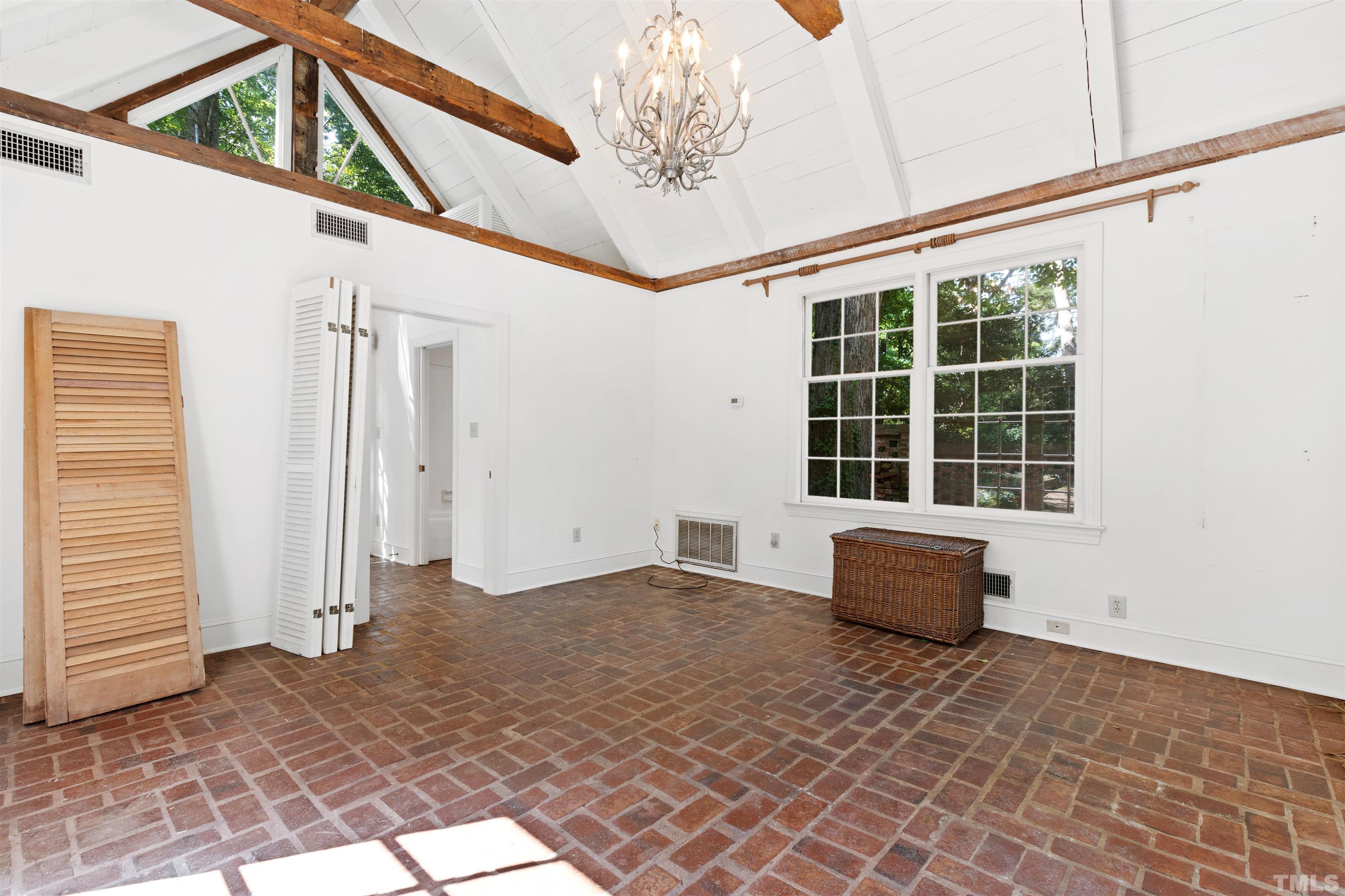 3231 Sussex Road Raleigh, NC 27607 - Photo 42 of 60 a view of an empty room with a window