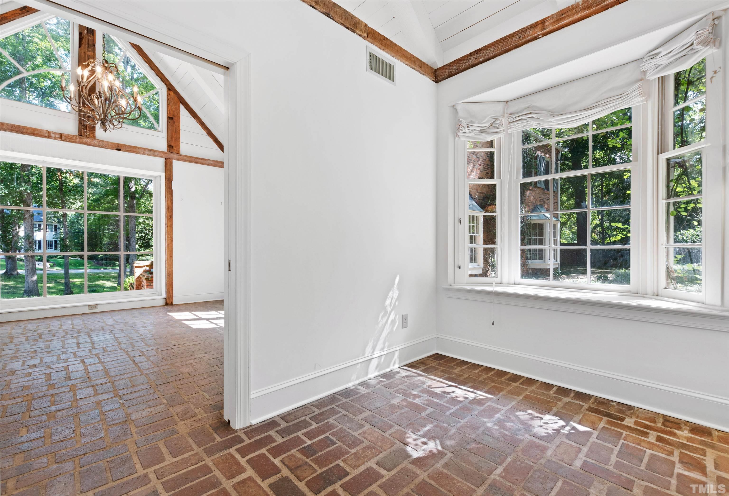 3231 Sussex Road Raleigh, NC 27607 - Photo 44 of 60 a view of an empty room with a window