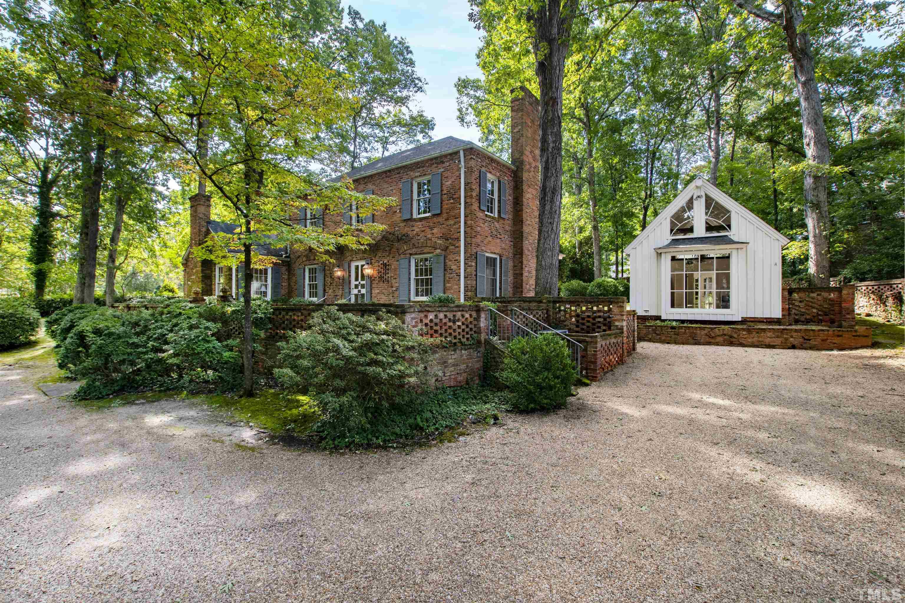 3231 Sussex Road Raleigh, NC 27607 - Photo 49 of 60 a view of a house with backyard and garden